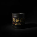 Luxury handcrafted black ceramic vessel with gold calligraphy, artisanal PROSPERA style