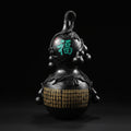 Luxury handcrafted black ceramic art gourd with intricate gold and green detailing