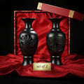 Luxury handcrafted black ceramic vases set of 2 with intricate carving, on red silk
