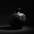 Handcrafted luxury black ceramic vase with intricate floral patterns, artisan home decor art